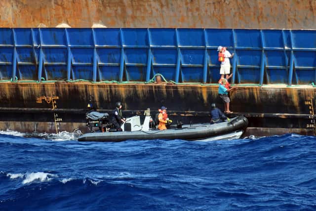 HMS Medway rescuing the crew of an ocean-going tug which started sinking off Anguilla in the Caribbean Picture: Able Seaman Mitchell 'Jack' Macguire/Royal Navy/PA Wire