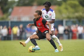 Marcus Harness has signed a three-year deal at Ipswich