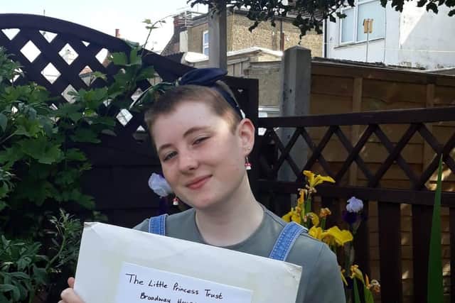 Elisha ready to post her hair to the Little Princess Trust