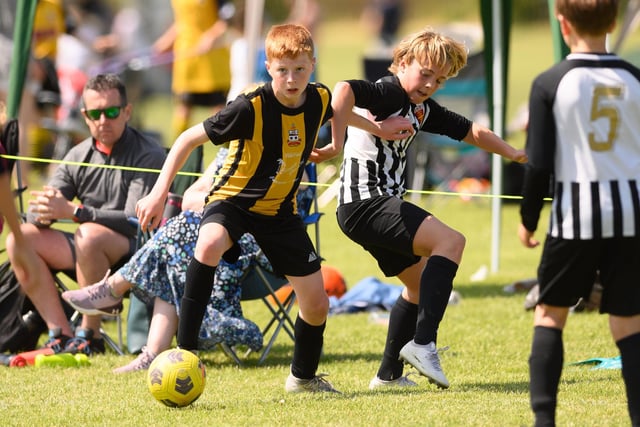 Action from the Clanfield youth football tournament at Horndean Technology College. Picture: Keith Woodland (270521-546)