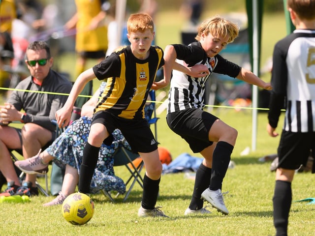 Action from the Clanfield youth football tournament at Horndean Technology College. Picture: Keith Woodland (270521-546)