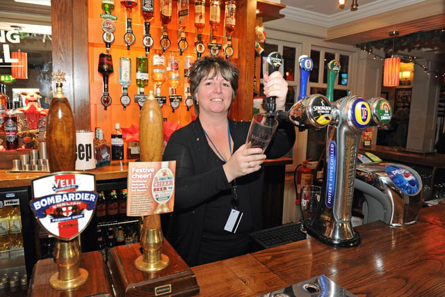 Landlady Eileen Stables behind the bar in 2011 (114460-8317)
