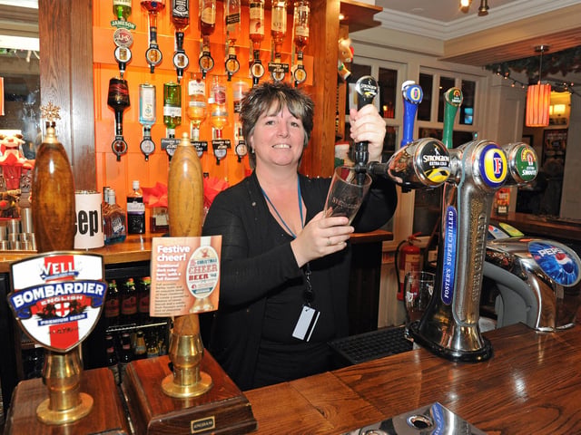 Landlady Eileen Stables behind the bar in 2011 (114460-8317)
