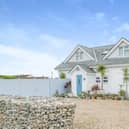 This property comes with four bedrooms and it has been refurbished to a high specification. It is in a gorgeous location and is less than 300m from the beach. The listing says: "It is situated less than 300m from the beach in a quiet cul de sac in the highly sought after village of East Wittering." For more information about the property, visit the Purple Bricks website.