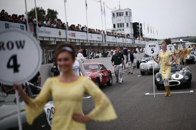Classic race cars get ready for a race on the opening day of the Goodwood Revival meeting 2023, north of Chichester in southern England on September 8, 2023. The only historic motor race meeting to be staged entirely in a period theme, Goodwood Revival is an immersive celebration of iconic cars and fashion.