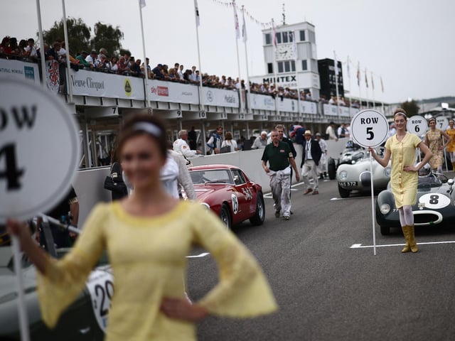 Classic race cars get ready for a race on the opening day of the Goodwood Revival meeting 2023, north of Chichester in southern England on September 8, 2023. The only historic motor race meeting to be staged entirely in a period theme, Goodwood Revival is an immersive celebration of iconic cars and fashion.