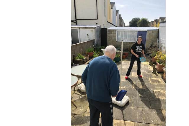 Caroline White has been self-isolating in Copnor with her dad Colin Wright, who has dementia. They have been painting rainbows for the windows and make their own swingball set to play.