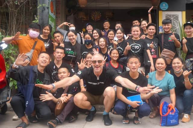 Mark Steadman (centre), from Fareham, co-founded the Lone Buffalo English school and youth development programme in Laos. He has now been made an MBE for his efforts.