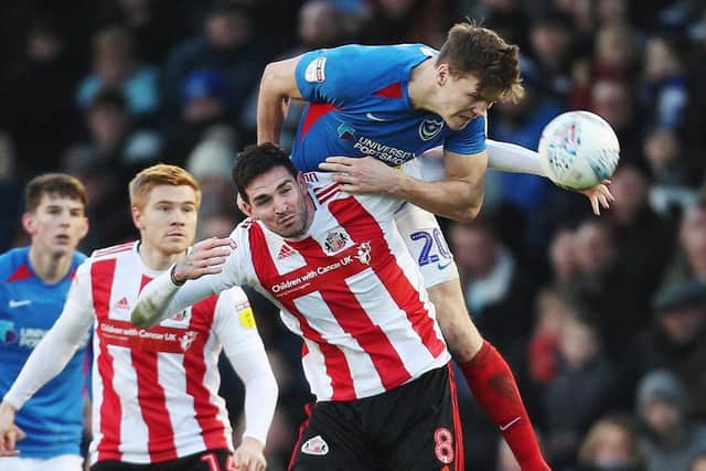 Sean Raggett wins a towering header in Pompey's 2-0 win against Sunderland in February. Picuture: Joe Pepler