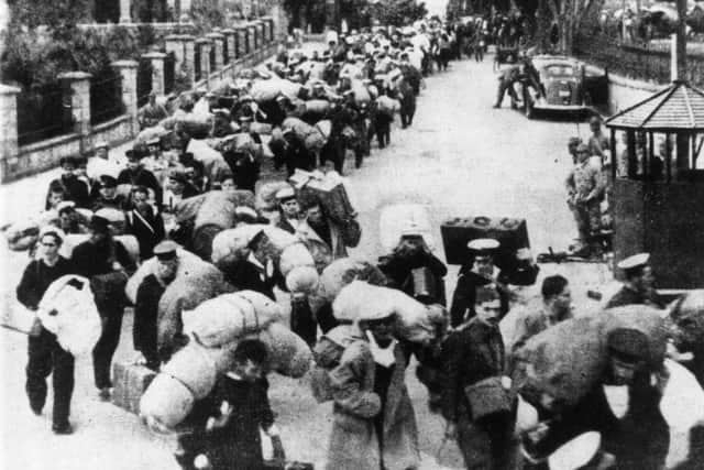 December 1941:  British prisoners of War leaving Hong Kong for a Japanese camp.  Picture: Keystone/Getty Images.