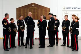 Britain's Princess Anne (C), Princess Royal, as Commodore-in-Chief Portsmouth, meets with members of the Royal Marines Band, who took part in Queen Elizabeth II's funeral procession, at Portsmouth Naval Base on September 22, 2022. (Photo by Andrew Matthews / POOL / AFP) (Photo by ANDREW MATTHEWS/POOL/AFP via Getty Images)