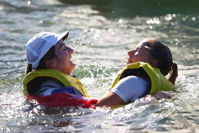 Eilidh McIntyre, left, and Hannah Mills celebrate their Olympic success. Photo by Clive Mason/Getty Images.