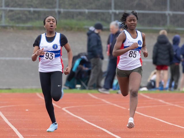 Abigail Cupid (85) and Adjara Seibou in the Under-15 girls 200m heats. Picture by Paul Smith