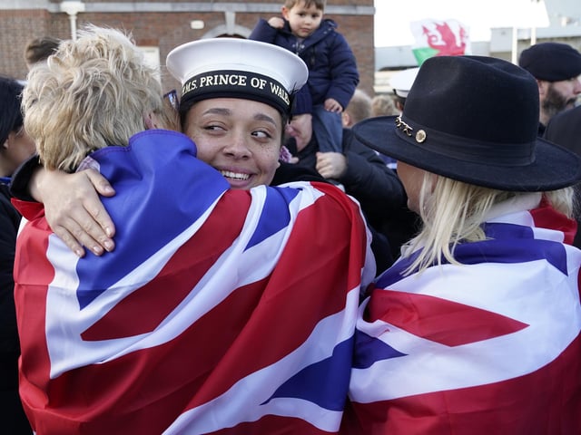 AB Yasmine Mante (centre) is greeted by family after the Royal Navy aircraft carrier HMS Prince of Wales returns to Portsmouth Naval Base following it's three-month deployment to the Eastern Seaboard of the United States, where the Prince of Wales has been undergoing trials and operating with aircraft and drones.