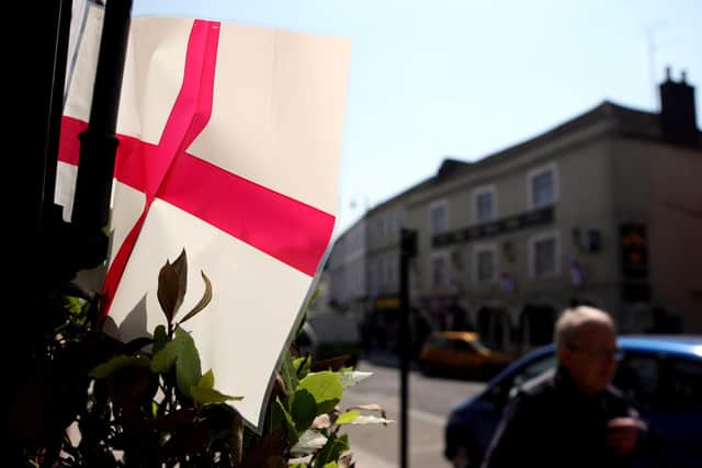 A flag adorns a home for St George's Day See PA Story Photo credit should read: Steve Parsons/PA Wire