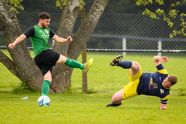 Action from Saturn Royale's 1-0 win over Pelham Arms (blue and yellow kit) in the second Adelaide Cup semi-final. Picture: Keith Woodland (300421-19)