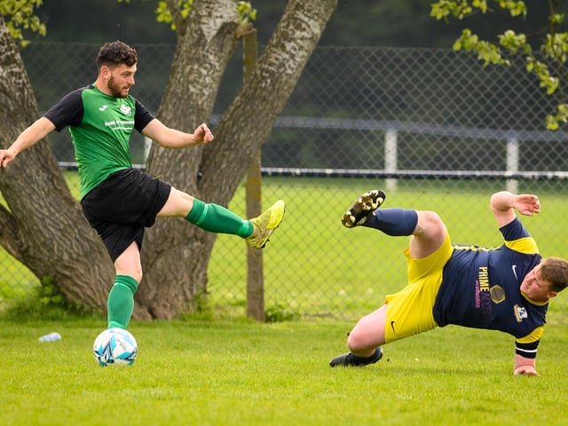 Action from Saturn Royale's 1-0 win over Pelham Arms (blue and yellow kit) in the second Adelaide Cup semi-final. Picture: Keith Woodland (300421-19)