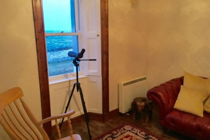 There's a telescope at the window to keep an eye out for wildlife in the waters below.