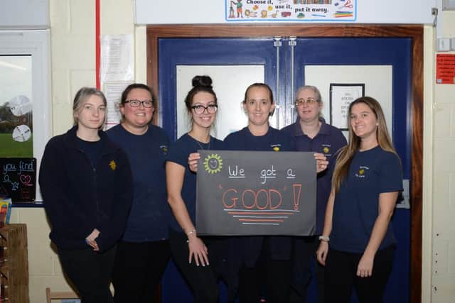 Staff at Denmead Day Care celebrate their result