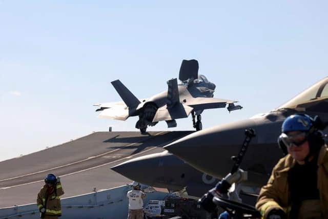 Lift off: the first RAF jet launches from HMS Queen Elizabeth on an operational mission targeting terrorists in Syria.