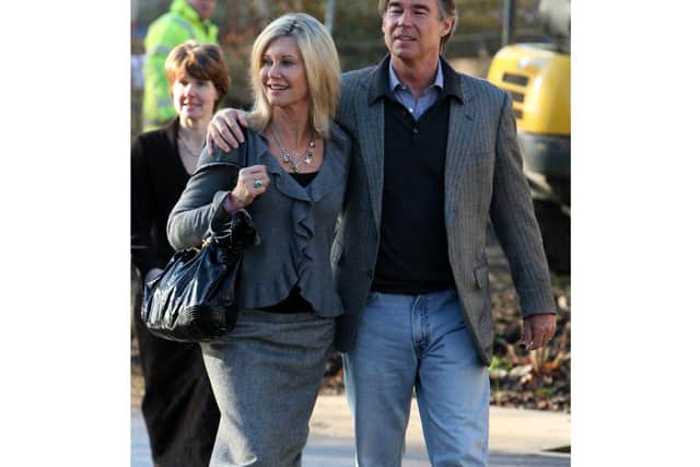 Dame Olivia Newton-John has died at the age of 73, File phot dated 14/01/09 of Olivia Newton-John and her husband John Easterling during a visit to the Oncology department at Addembrooke's Hospital in Cambridge, Cambridgeshire. Picture: Chris Radburn/PA.