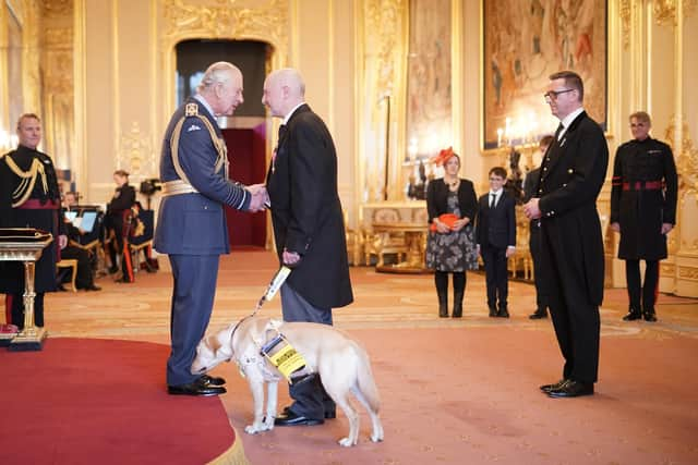 Stamp also gave His Majesty a good sniff, just to be sure. Picture: Yui Mok / PA