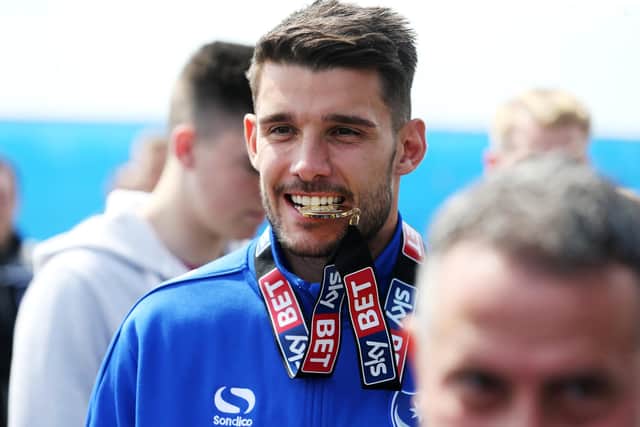 A well-oiled Gareth Evans at the League Two title celebrations in 2017. Picture: Joe Pepler