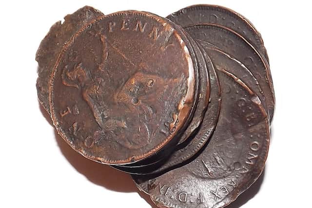 Pennies from the old days that melted in the heat of the blitz.  Picture: Bob Hind