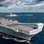 HMS Queen Elizabeth pictured with F-35s on her flight deck and HMS Dragon in the background. Photo: Royal Navy