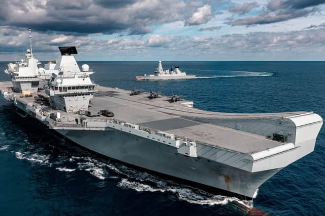 HMS Queen Elizabeth pictured with F-35s on her flight deck and HMS Dragon in the background. Photo: Royal Navy