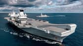 HMS Queen Elizabeth pictured with F-35s on her flight deck and HMS Dragon in the background. Photo: Royal Navy