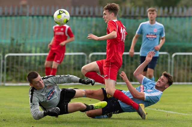 Harry Jackson (red) was among the scorers as Horndean hit back to win at Shaftesbury and extend their 100 per cent start to the Wessex League season. Picture: Keith Woodland
