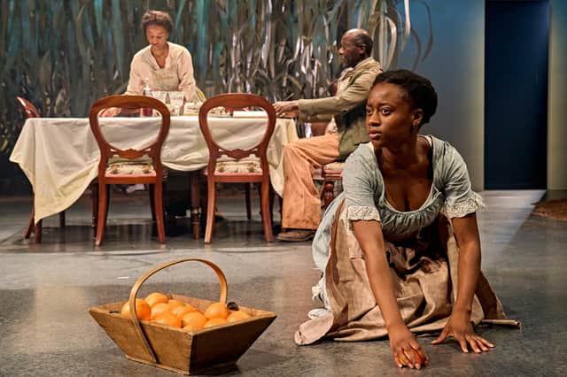 Tara Tijani (centre, as July), Perola Congo and Trevor Laird in The Long Song at Chichester Festival Theatre. Photo by Manuel Harlan