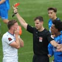 Jake McCarthy is shown a red card by Harry Wager. Picture by Dave Haines