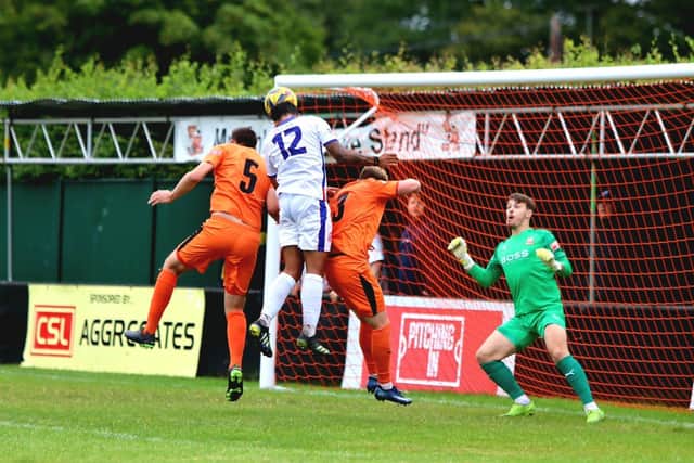 Theo Lewis heads the only goal. Picture: Tom Phillips.