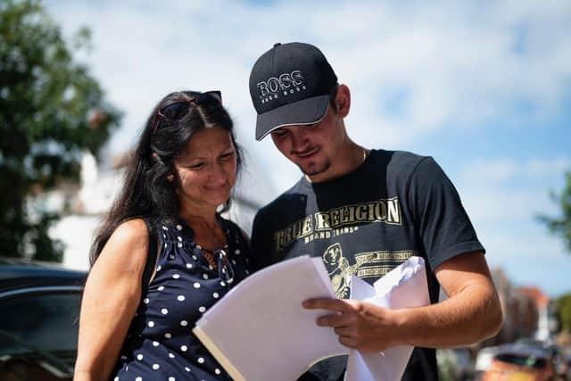 Students at Mayville High School receive their results.