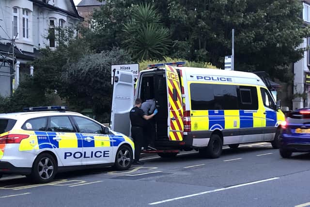 Police detain a man in a van outside a property in North End. Photo: Tom Cotterill