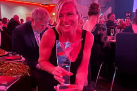 Not only a rising star but a shining star look at that smile proudly showing off her award