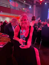Not only a rising star but a shining star look at that smile proudly showing off her award