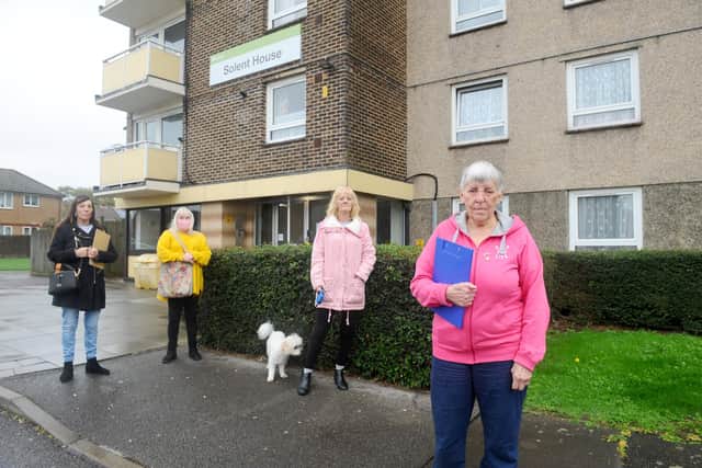 Residents at Guinness flats in West Leigh are angry as the housing association is taking away their storage sheds to provide a sprinkler system and not providing an alternative storage facilty.Pictured is: Solent House residents (l-r) Denise Jenkins (58), Jules Young (56), Lorraine Kirby (66) and her dog Bud and Jenny Wright (72).Picture: Sarah Standing (301020-7330)