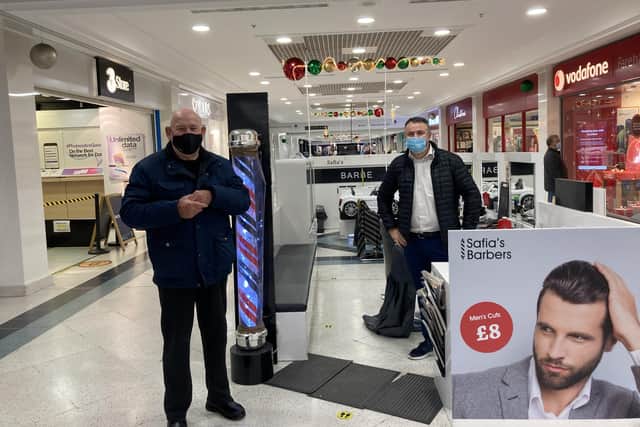 Aleks Vuksani, 43, from Southsea was ready to cur hair at Safias Barbers in Fareham Shopping Centre, with customer Colin White, 77, from Waterlooville.