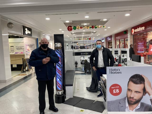 Aleks Vuksani, 43, from Southsea was ready to cur hair at Safias Barbers in Fareham Shopping Centre, with customer Colin White, 77, from Waterlooville.