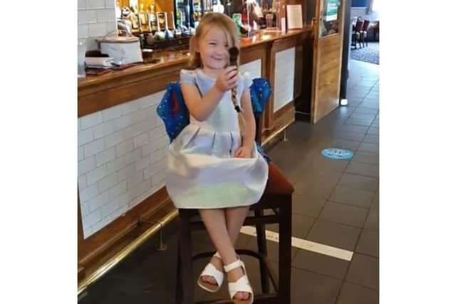 Poppy Crown, 5 from Leigh Park, had her hair chopped for the Little Princess Trust and was surprised by a visit from Frozen's Princess Anna. Pictured: Poppy with the hair cut off