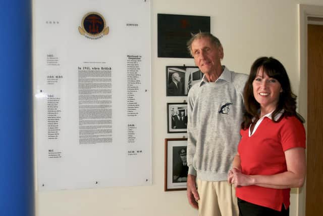 Combined Operations Pilotage Parties member Jim Booth with Discover Hayling‘s Wendy Evans (right) pictured in front of the COPP honours board at Hayling Island Sailing Club during a visit to the old base of the wartime clandestine commando team, on April 22, 2010 Picture: Andrew Griffin / AMG PICTURES