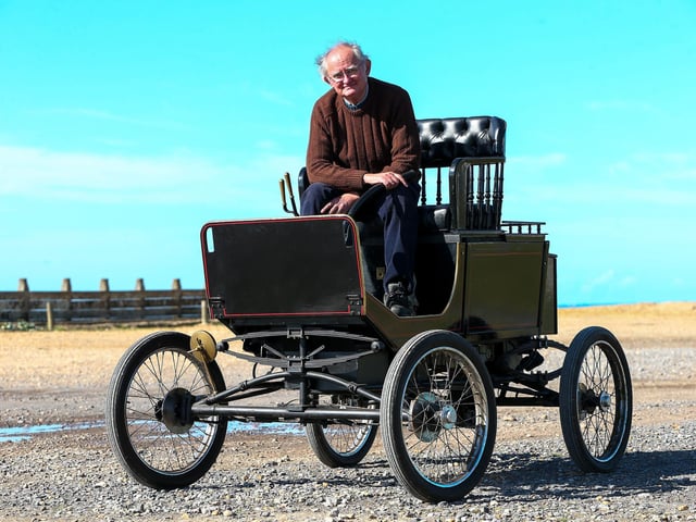 Rod Southern aboard his replica steam car. The 1902 original used petrol to heat the boiler. Mr Southern's uses kerosene.