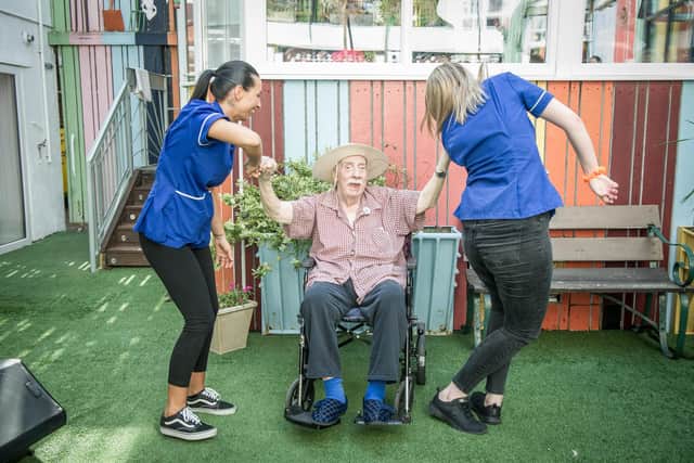 Bluewater Care Home resident Leonard White, with Cherish Matthews and Beth Ward - in happier times before the coronavirus outbreak. Picture: Habibur Rahman