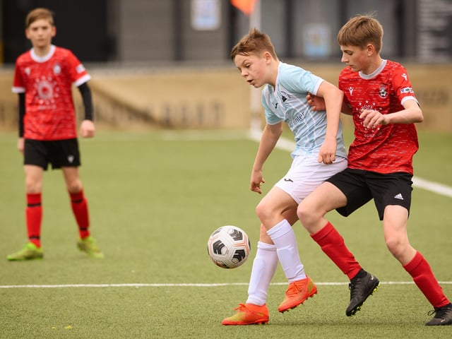 Action from the Portsmouth Youth League Geldard Invitation Cup final between Jubilee 77 U13s and Castle United U13s (light blue and white kit). Picture: Keith Woodland (190321-458)