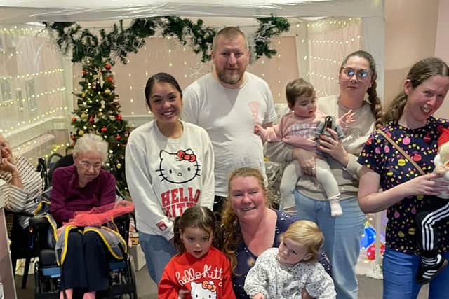 Parents and children from St Simon's Church in Southsea, visiting residents of Bluebell Nursing Home in Southsea