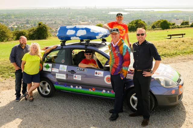 The team with the car and their sponsors (from left) Jason Munro, Andy Painting, David England, Mark Powell and Tony Wells.