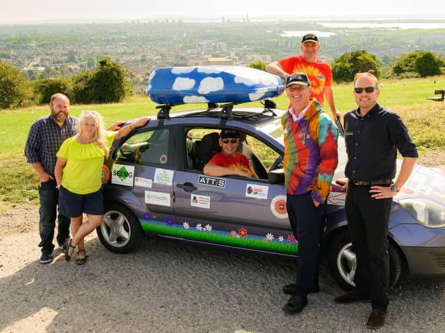 The team with the car and their sponsors (from left) Jason Munro, Andy Painting, David England, Mark Powell and Tony Wells.